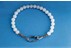 Beaded retaining rings for internal halyard flagpoles.
